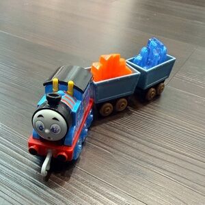 Blue and Black Toy Train with Orange and Blue Cargo